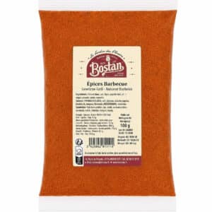 Bag of orange barbecue seasoning powder with a beige label reading 'Épices Barbecue' and brand 'Bostan' on the packaging (100 g).