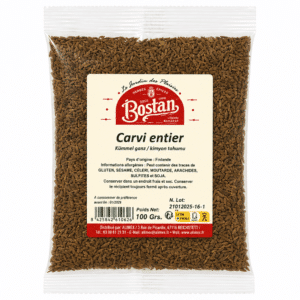 Clear plastic bag filled with brown caraway seeds; label reads 'Carvi entier' (whole caraway) and brand logo.