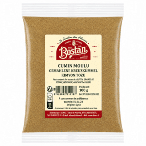 Bag of ground cumin spice in a sealed plastic pouch with a beige label reading 'CUMIN MOULU' and brand 'Bostan' (100 g) from Syria.