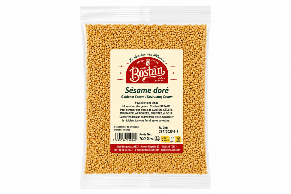 Bag of golden sesame seeds in a clear plastic pouch with a beige label reading 'Sésame doré' and brand 'Bostan' at the center.