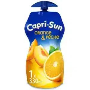 Capri-Sun orange and peach juice pouch with blue cap, showing sliced orange and peaches (330 ml).