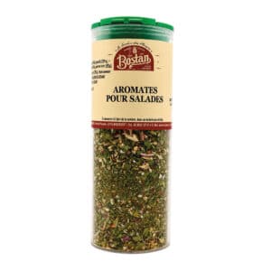 Salad seasoning mix in a tall clear bottle with a green lid and beige label that reads Aromates Pour Salades (Bostan).