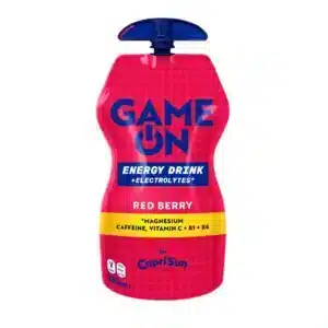Pink 'Game On' energy drink pouch labeled Red Berry, by Capri Sun, with a blue cap top and yellow caffeine band, 330 mL