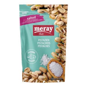 Bag of Meray Nats salted pistachios with pistachio shells along the right edge and a scoop of salt at the bottom; includes California pistachios logo.